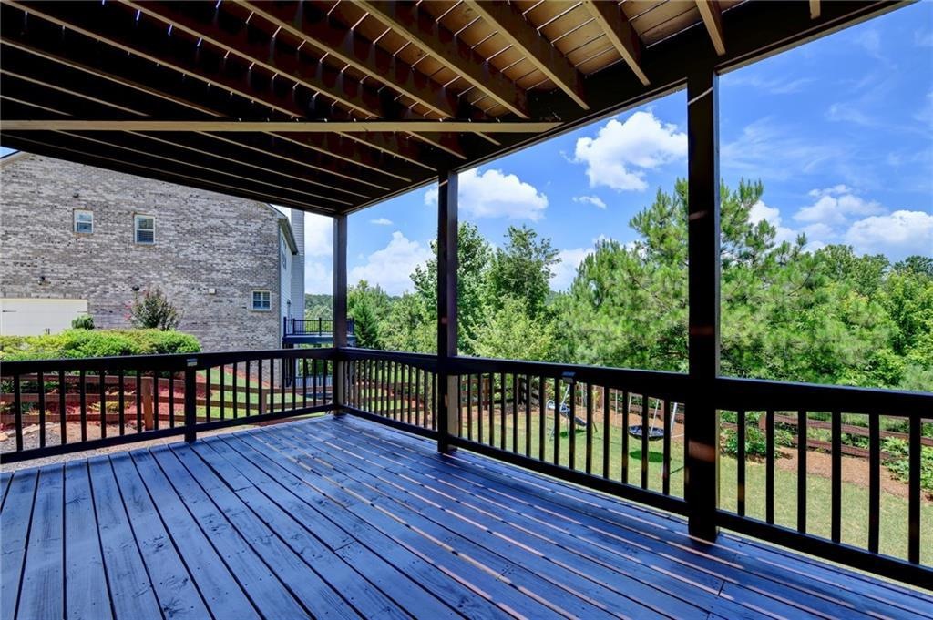 Covered lower deck overlooking trees